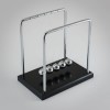 The Source Newton’s Cradle Η κούνια του Νεύτωνα